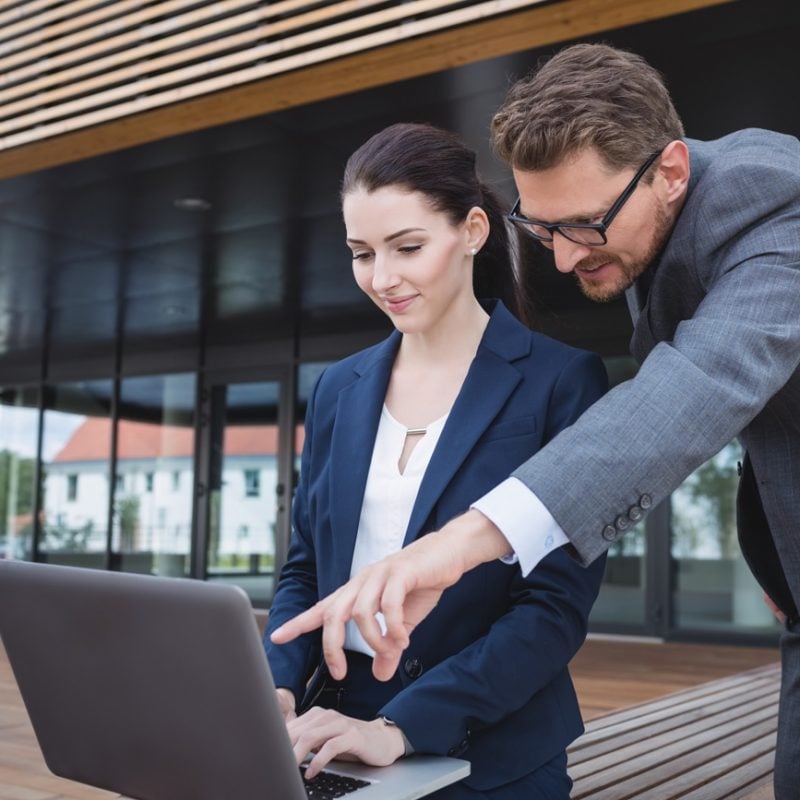 businesswoman-colleague-using-laptop